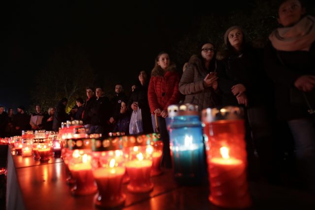 Bosnian Croats gather to light candles and pray for Gen Praljak (Amel Emric/AP)