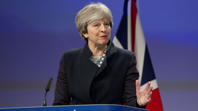 Theresa May is under pressure to move on to the next stage of Brexit talks before the end of the year (Virginia Mayo/AP)