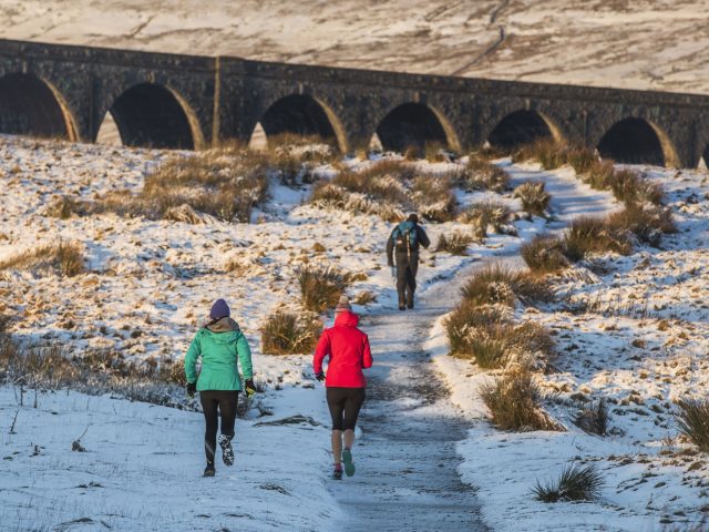 Runners at Ribblehead Viaduct in North Yorkshire (Danny Lawson/PA)
