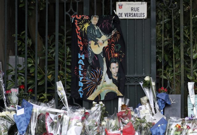 Flowers outside Johnny Hallyday's house in Marnes-la-Coquette. (Christophe Ena/AP)