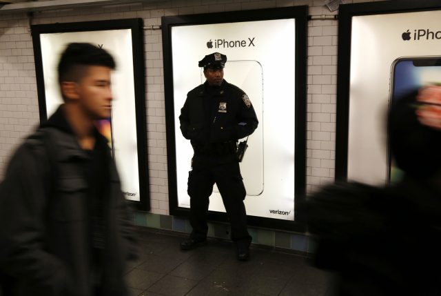 Police patrol the passageway, which is back in use (Seth Wenig/AP)