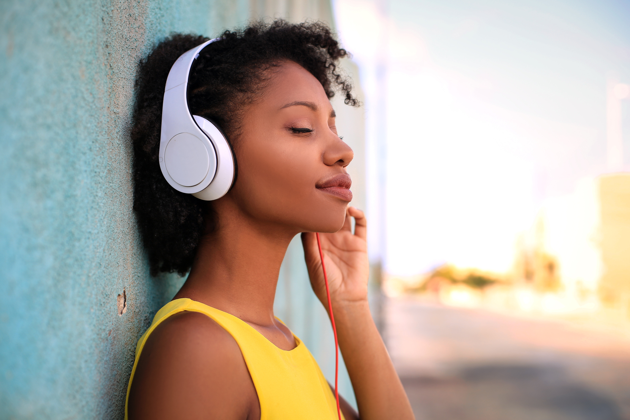 Young girl listening music in the street with her headphones (Thinkstock/PA)