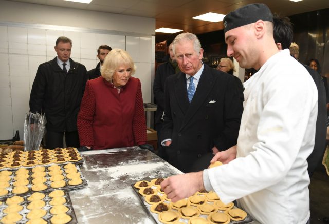 Charles and Camilla meet stall-holders and members of the local community at Borough Market (Clodagh Kilcoyne/PA)