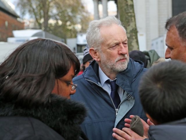 Labour leader Jeremy Corbyn and Diane Abbott speak with people after the service (Gareth Fuller/PA)