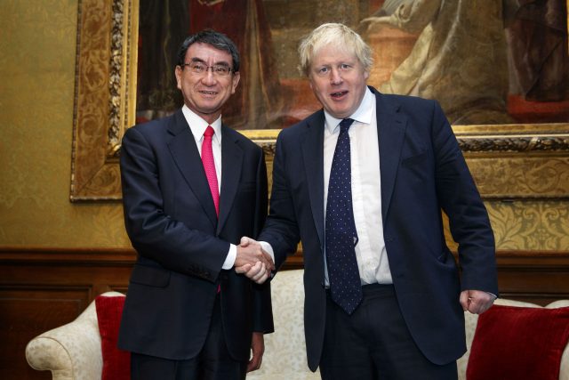 Boris Johnson shakes hands with Japan's Foreign Minister Taro Kono at the Foreign office in London (Tolga Akmen/PA)