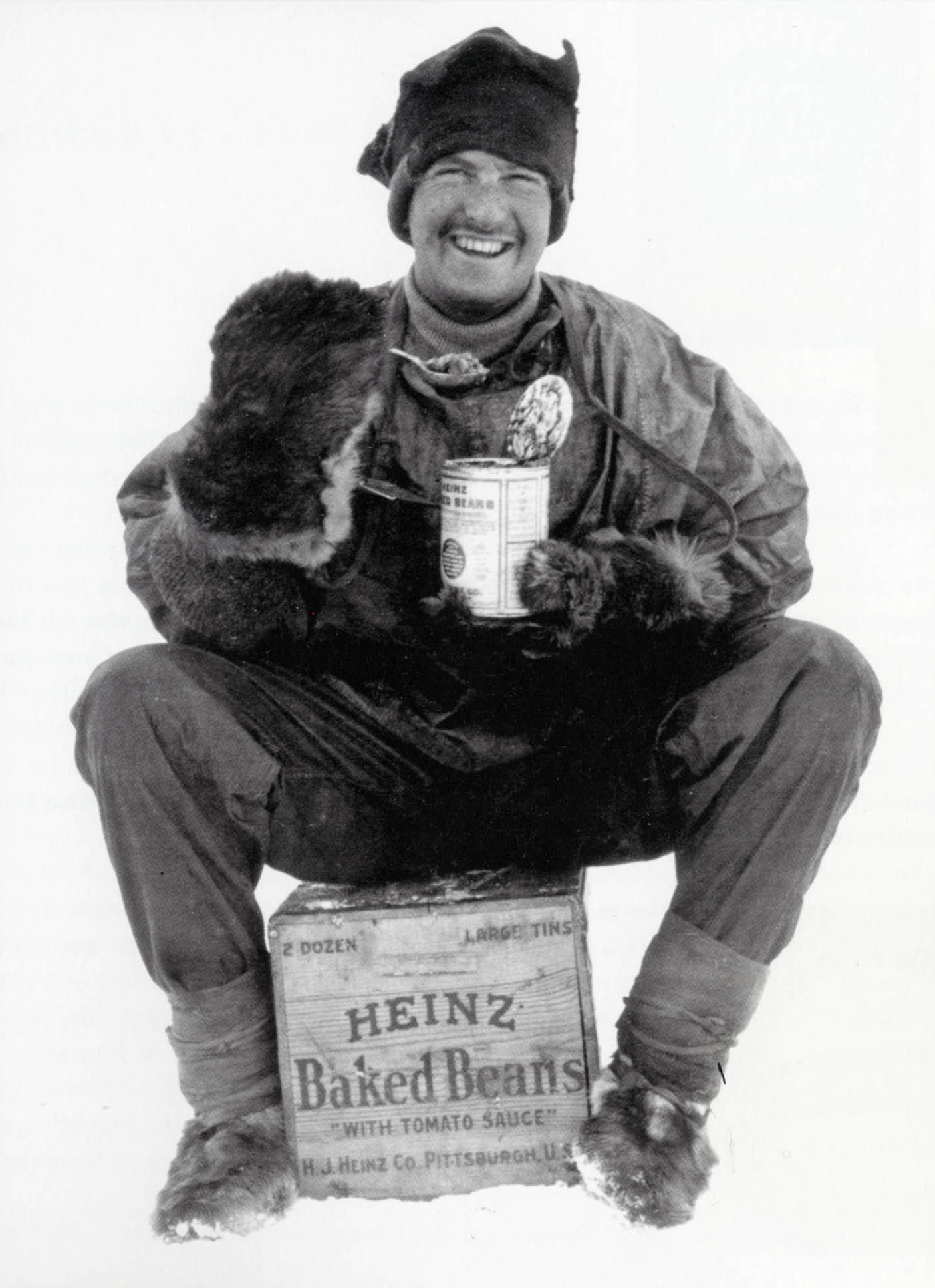 Explorer FJ Hooper eating a can of baked beans during the doomed 1910 British Antarctic expedition (Heinz/PA)