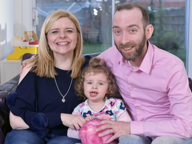 John and Kelly Davie and their daughter Lucy, two, in their new home