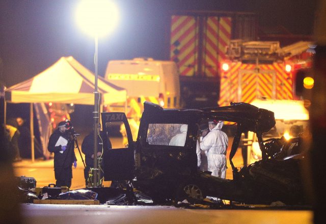 Police at the scene of the multi-vehicle crash at the entrance to the underpass (Aaron Chown/PA)