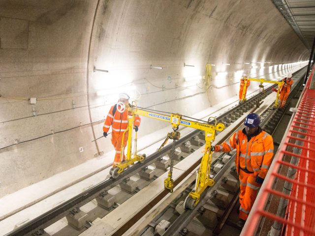 Engineers working on the track at Farringdon station as TfL marks one year until the Elizabeth line is launched (Transport for London/PA)