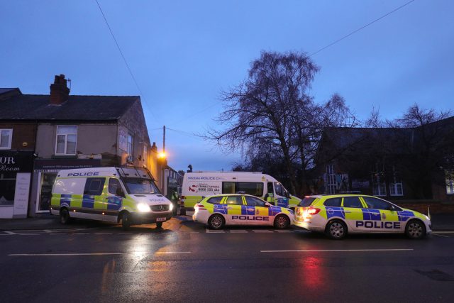 Police near a property in Chesterfield (Aaron Chown/PA)