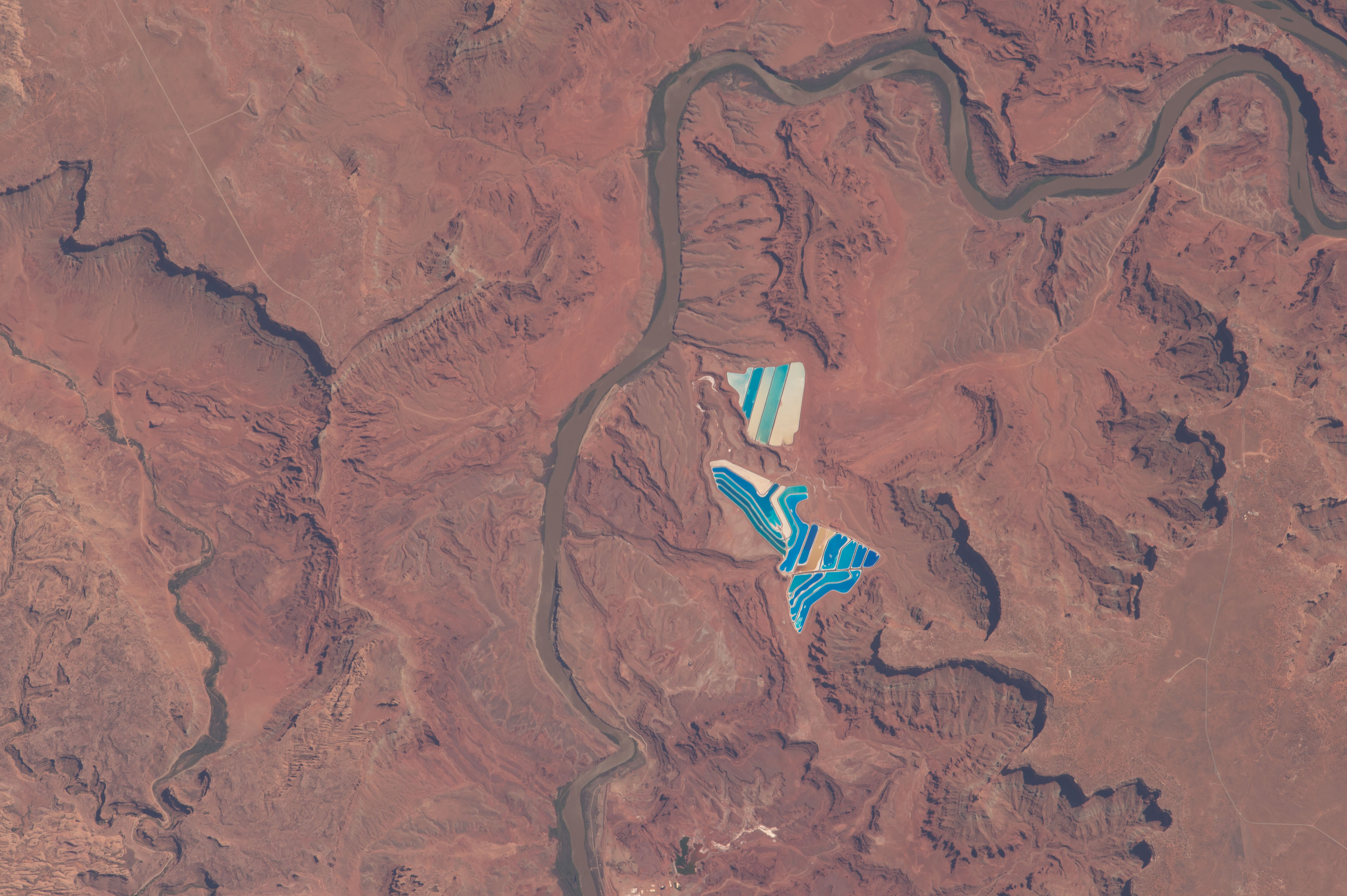 Solar evaporation ponds outside the city of Moab, Utah. There are 23 colourful ponds spread across 400 acres. They are part of a large operation to mine potassium chloride (Nasa)