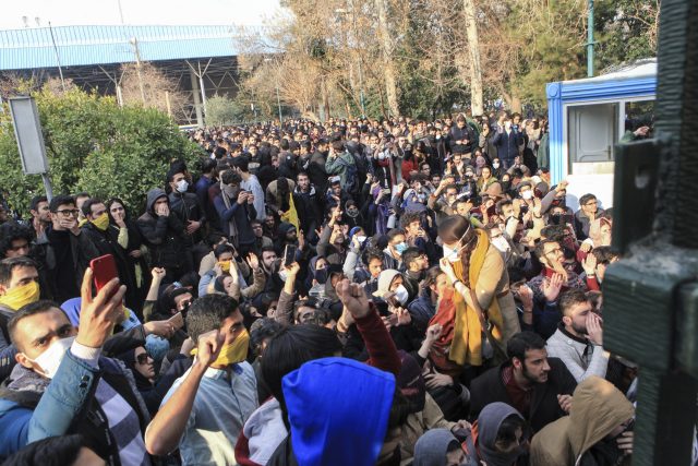 Students attend a protest at Tehran University (AP)