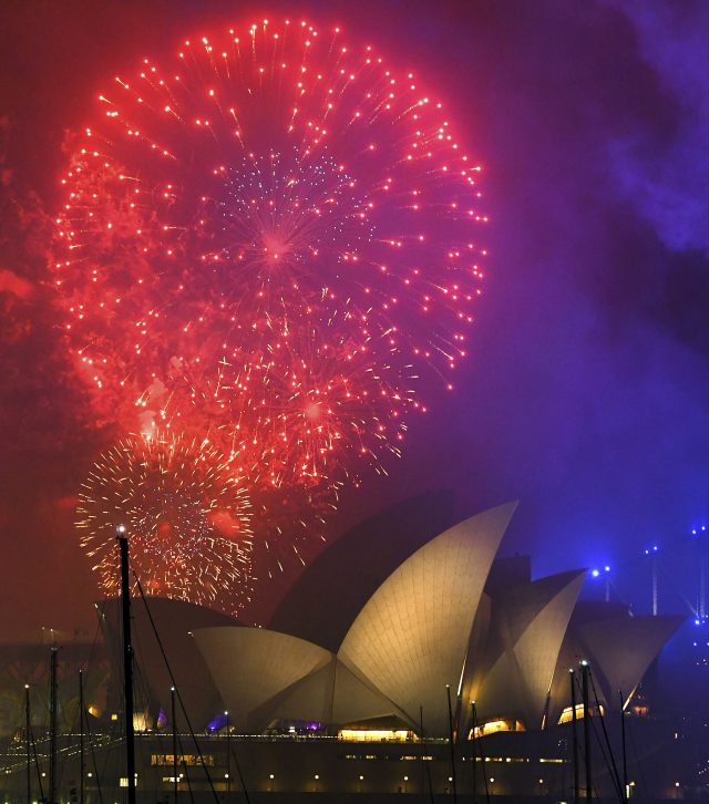 Fireworks explode over the Opera House during New Year's Eve celebrations in Sydney, Australia (David Moir/AAP Image via AP)