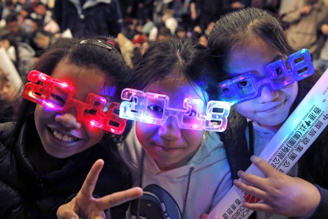 Hong Kong residents wear 2018 glasses (Kin Cheung/AP)