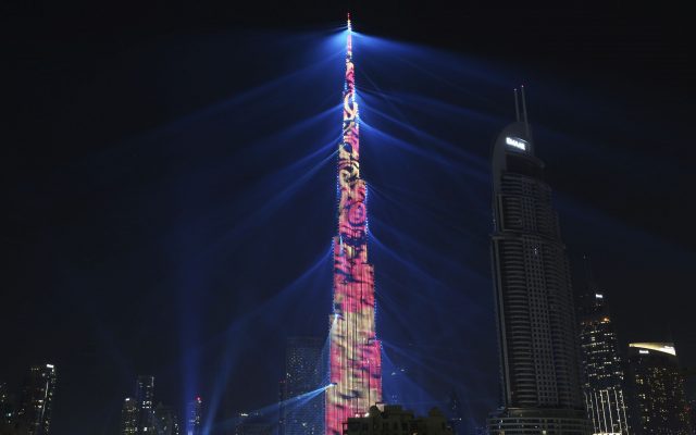 An LED light show illuminates the Burj Khalifa, the world's tallest building, to celebrate the New Year in Dubai (Jon Gambrell/AP)