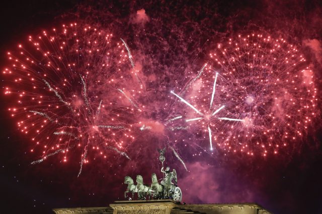 Fireworks light the sky above the Quadriga at the Brandenburg Gate in Berlin (Markus Schreiber/AP)