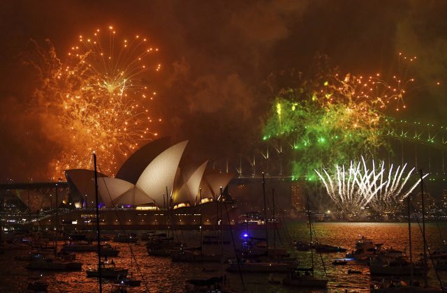Fireworks explode over Sydney Harbour landmarks (David Moir/AAP Image via AP)