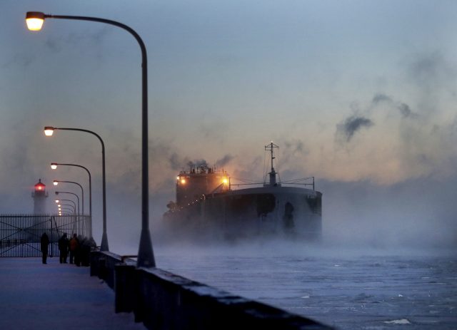 Steam rises from Lake Superior as the ship St Clair comes to berth   (David Joles/Star Tribune via AP)