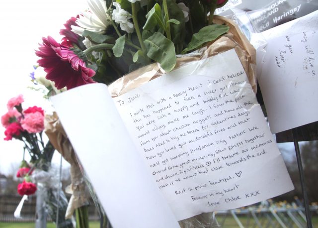 A message written on a card left in tribute to Iuliana Tudos (Yui Mok/PA)