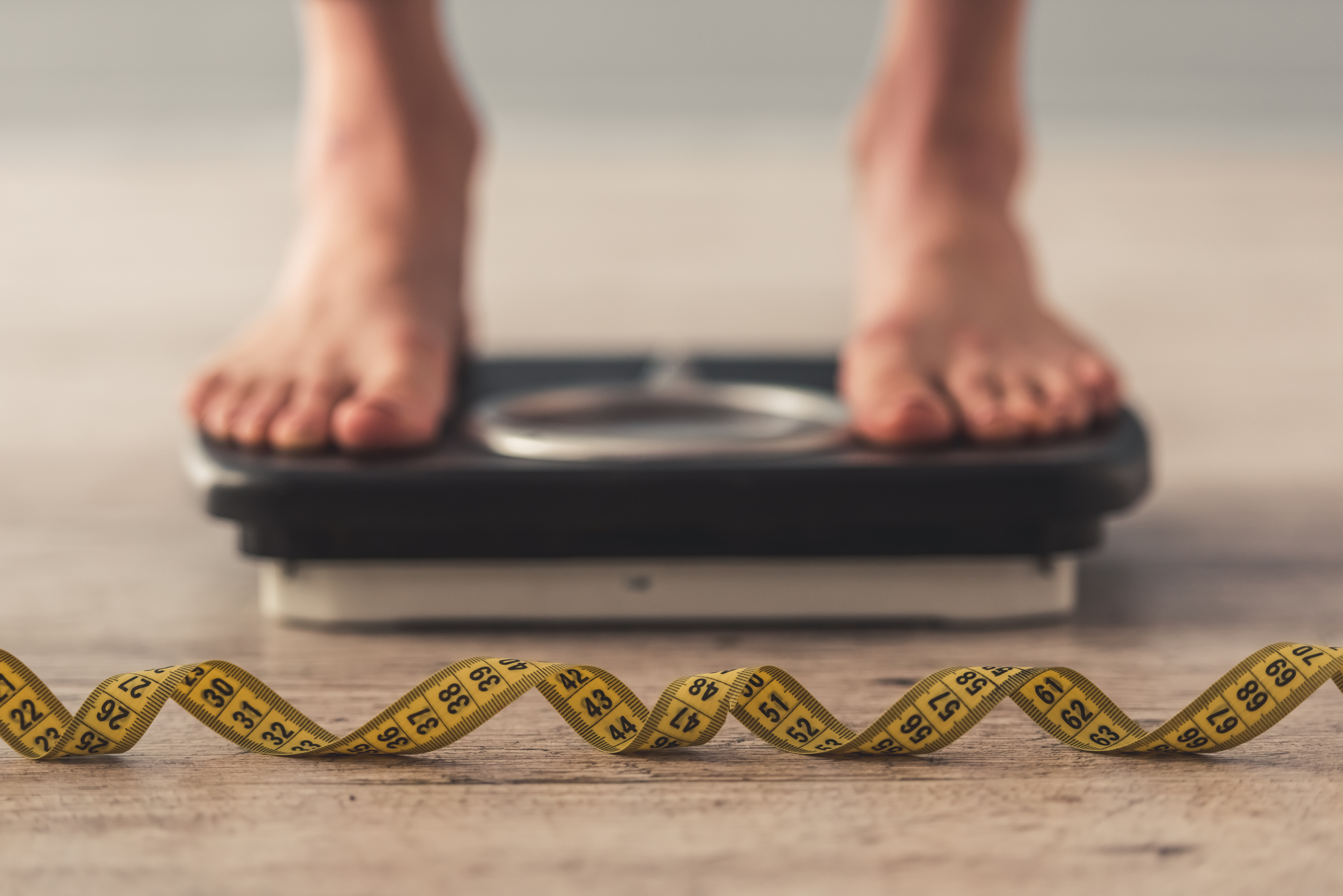 Woman standing on weighing scales (Thinkstock/PA)