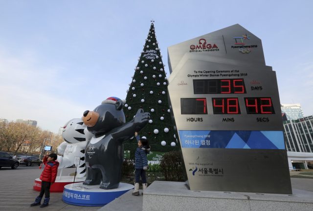 An electric board shows the number of days left until the opening of 2018 Pyeongchang Winter Olympic Games, in Seoul, South Korea (Ahn Young-joon/AP)