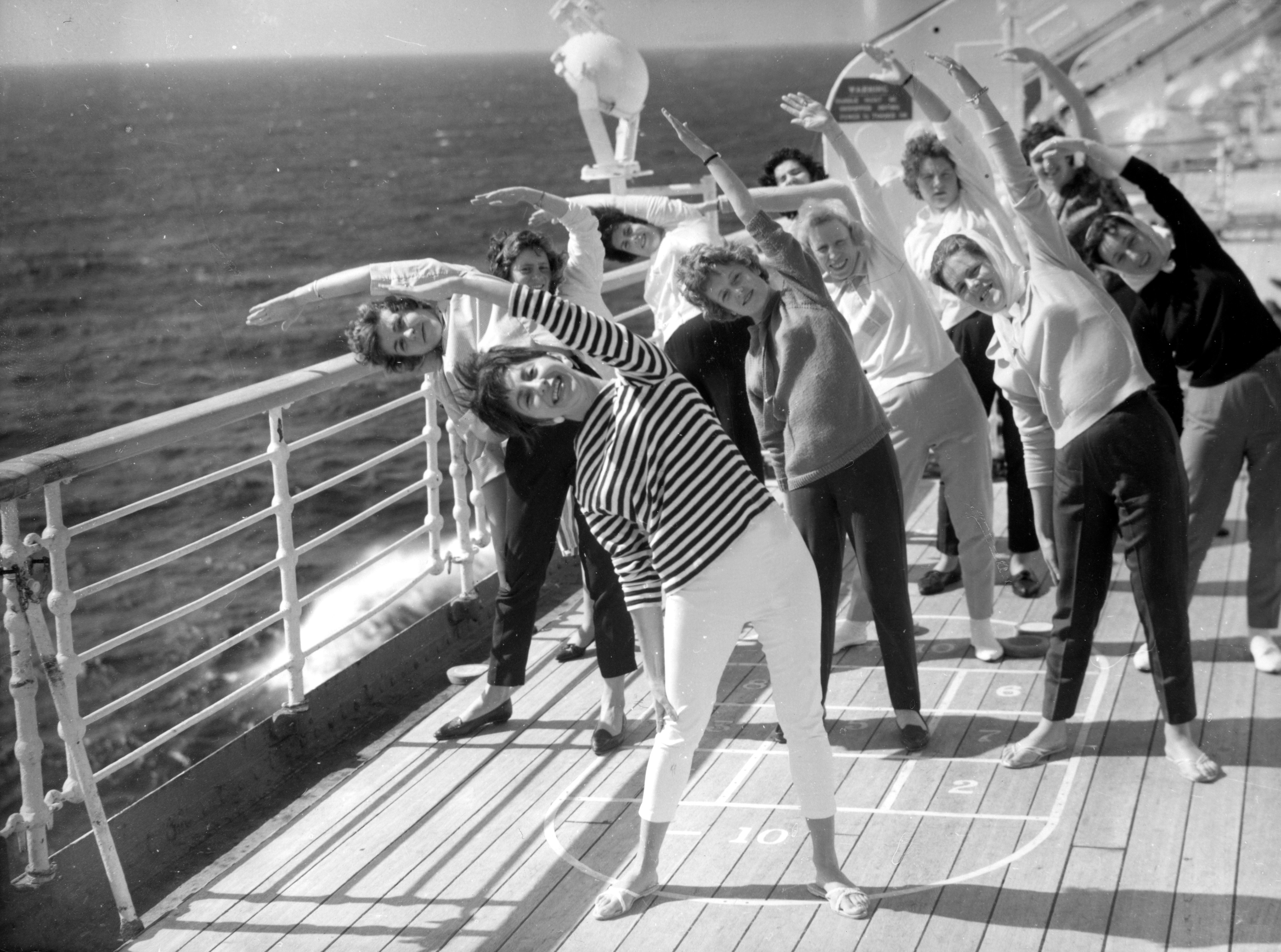 Dancer Lesley Ross from Sussex leads an exercise session on the deck of the Cunarder Sylvania in the mid-Atlantic. (PA)