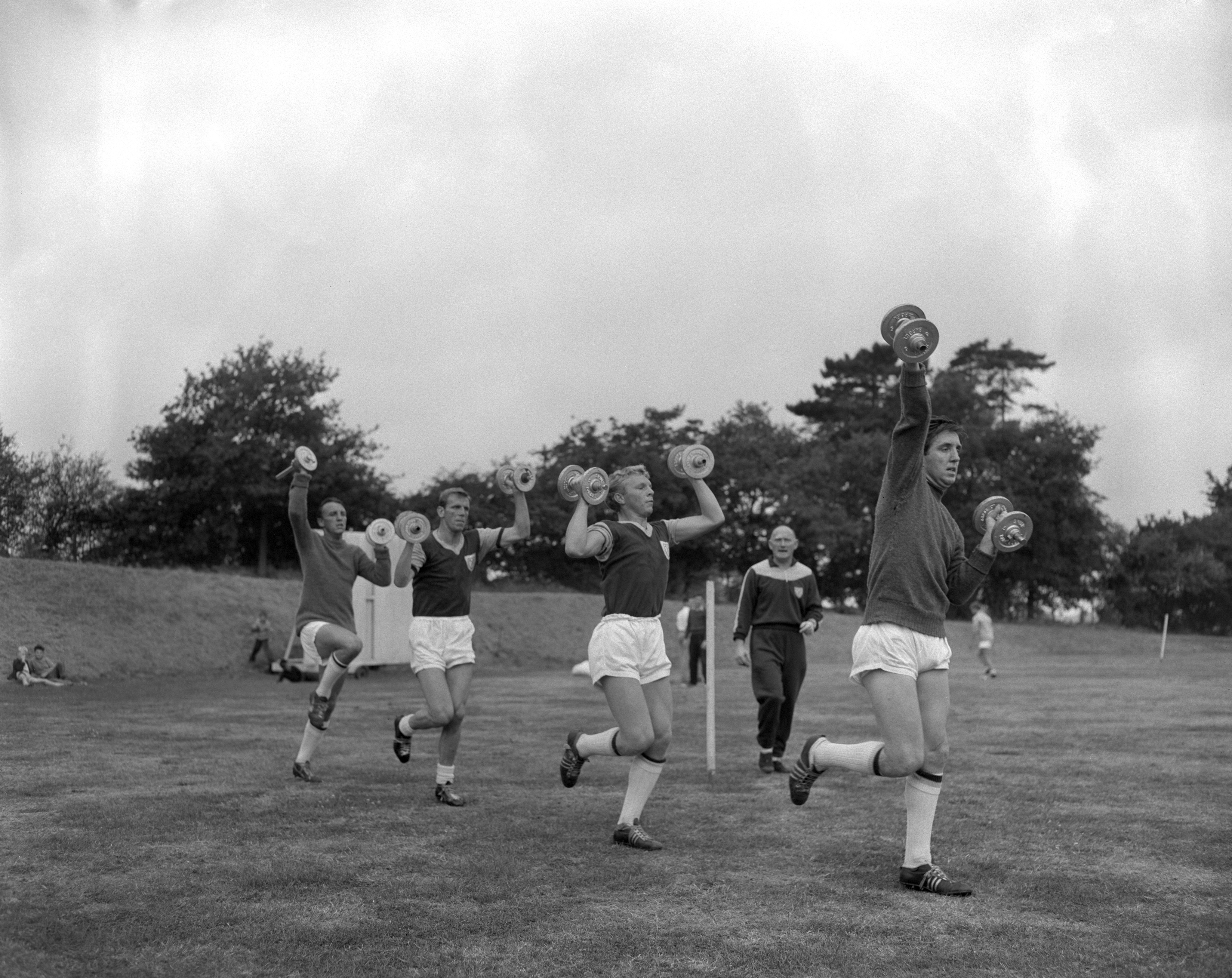 West Ham players, including Bobby Moore (centre), in training in 1959 (PA)