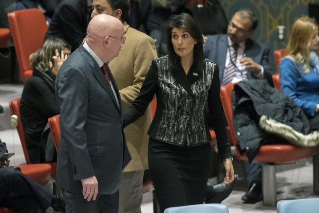 Vasily Nebenzya speaks to Nikki Haley before a Security Council meeting on Iran (Mary Altaffer/AP)
