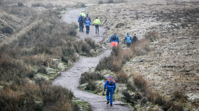 Walkers ascent Pen Y Fan, the highest peak in South Wales (Ben Birchall/PA)