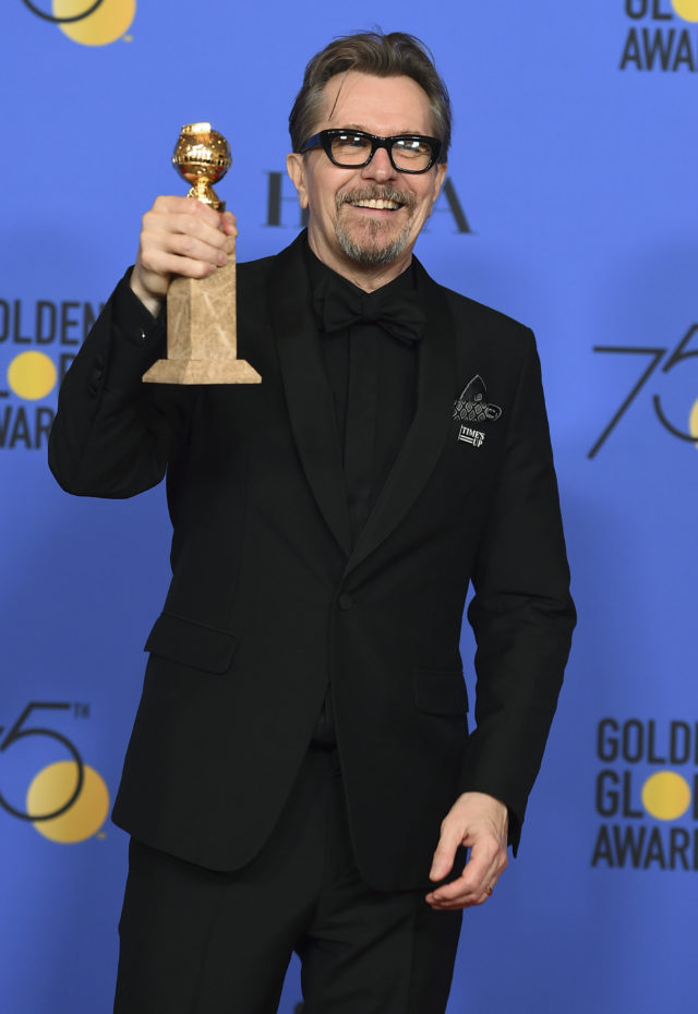 Gary Oldman shows off his Golden Globe