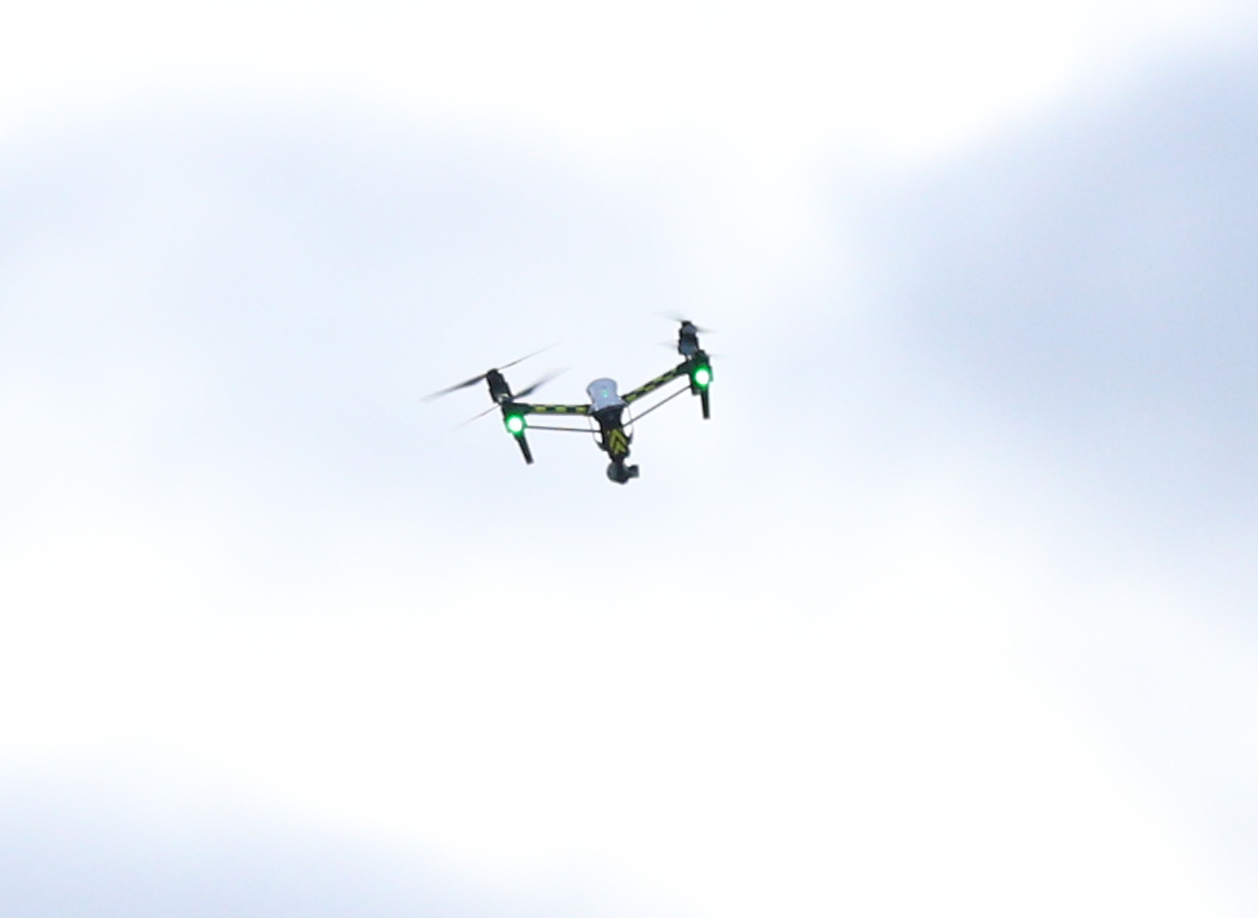 A traditional drone hovers in the air