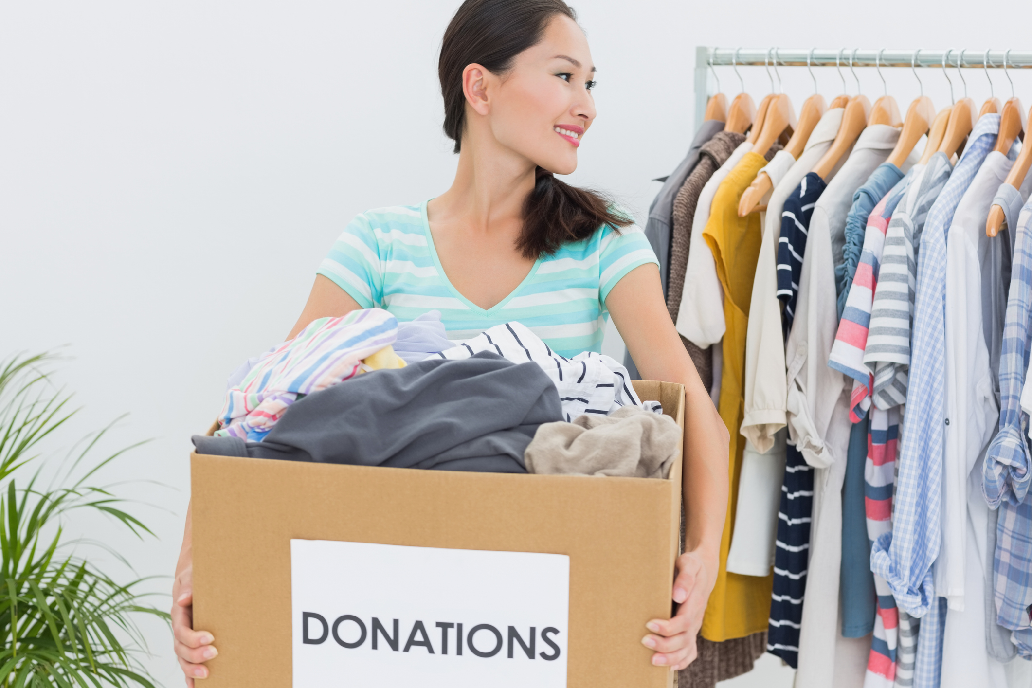 Generic photo of woman sorting clothes to give to charity (Thinkstock/PA)