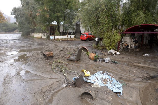 Mud washes away personal belongings along La Tuna Canyon road in the Sun Valley neighbourhood of Los Angeles (David Crane/Los Angeles Daily News via AP)