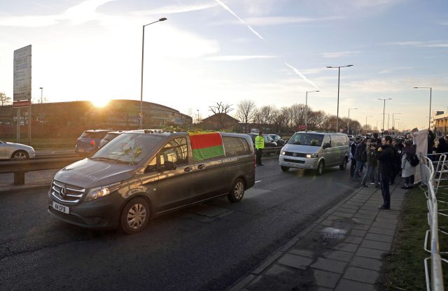 The coffins of British men Jac Holmes and Ollie Hall leave Heathrow Airport (Steve Parsons/PA)