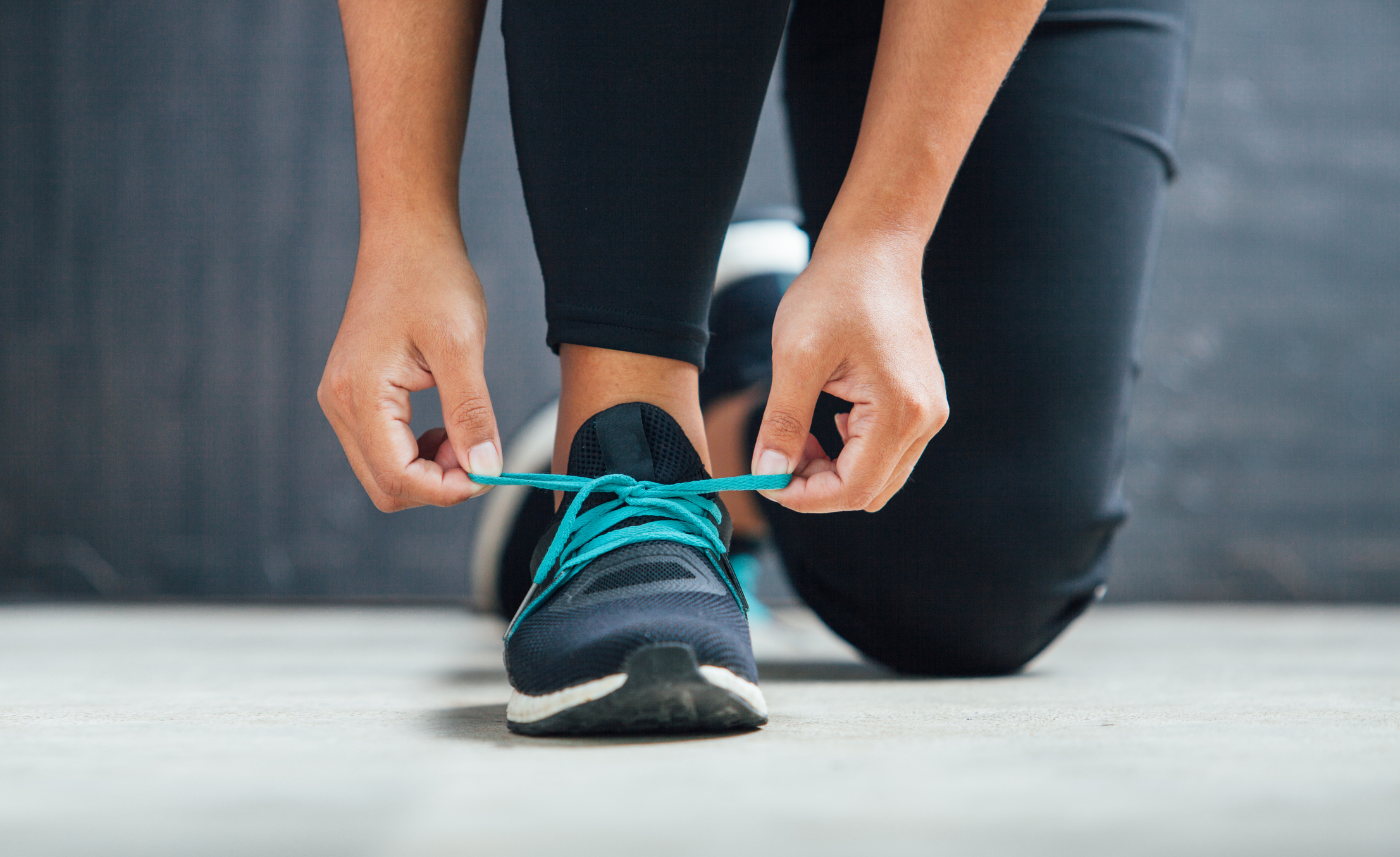 Female runner tying her shoes preparing for a run (Thinkstock/PA)