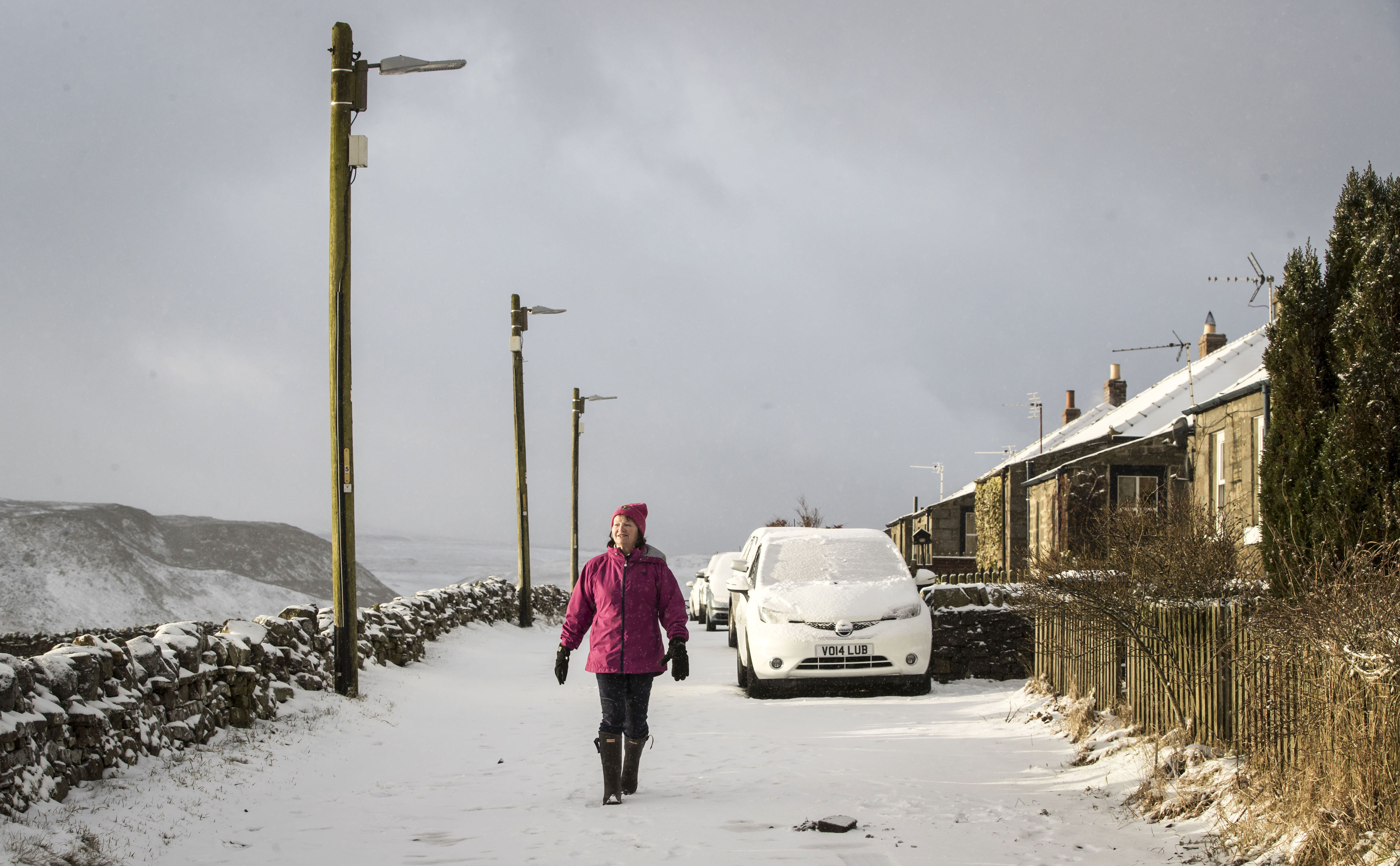 A woman in Longdon Beck as the area in the North Pennines was blanketed by snow overnight (Danny Lawson/PA)