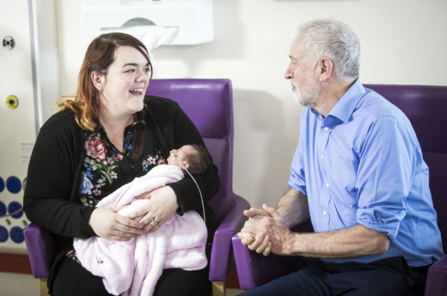 Labour leader Jeremy Corbyn meets Ayesha Flannery and her two-week-old daughter Polly-Jean. (Danny Lawson/PA)
