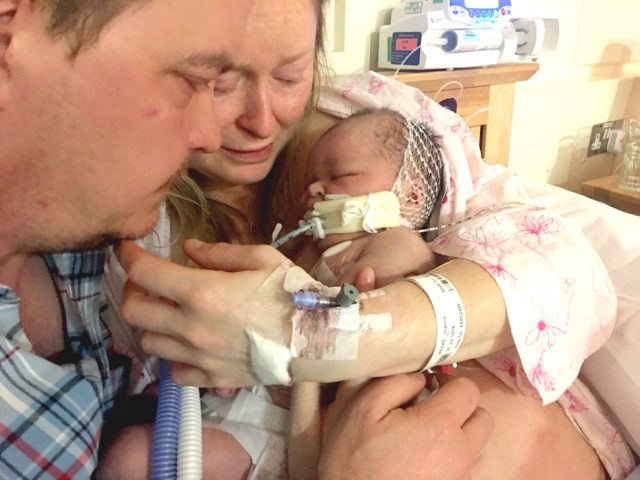 Jo Meeke and Matt Gurney with their son Puck before he died. (Family handout/PA)