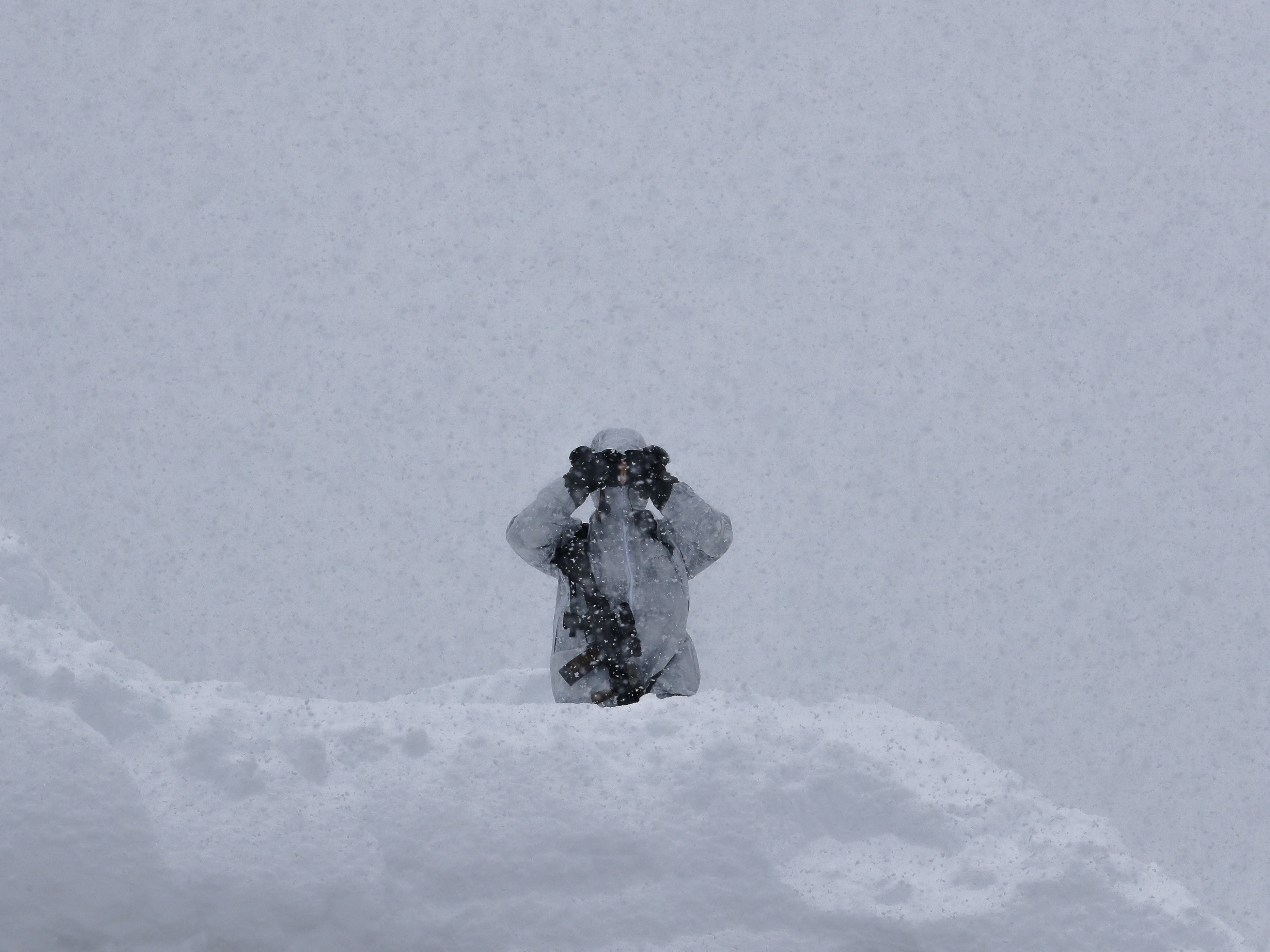 A Swiss police officer on duty at Davos (Markus Schreiber/AP)