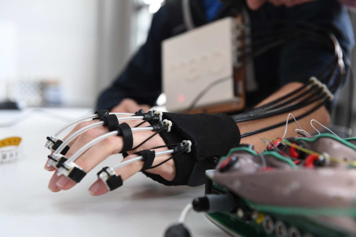 This hand exoskeleton for people with paralysis can be controlled by