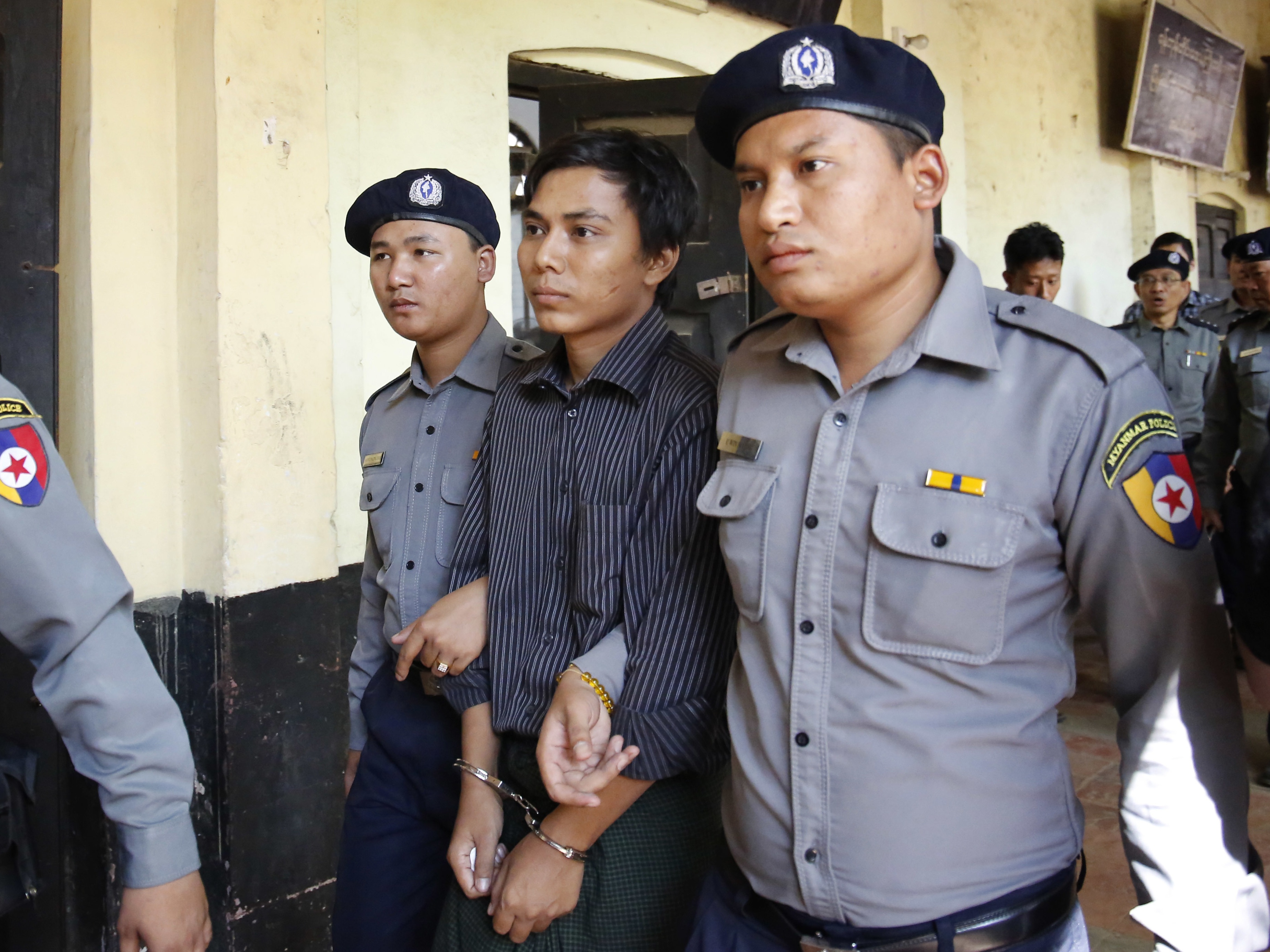 Kyaw Soe Oo is escorted from court (Lamin Tun/AP)