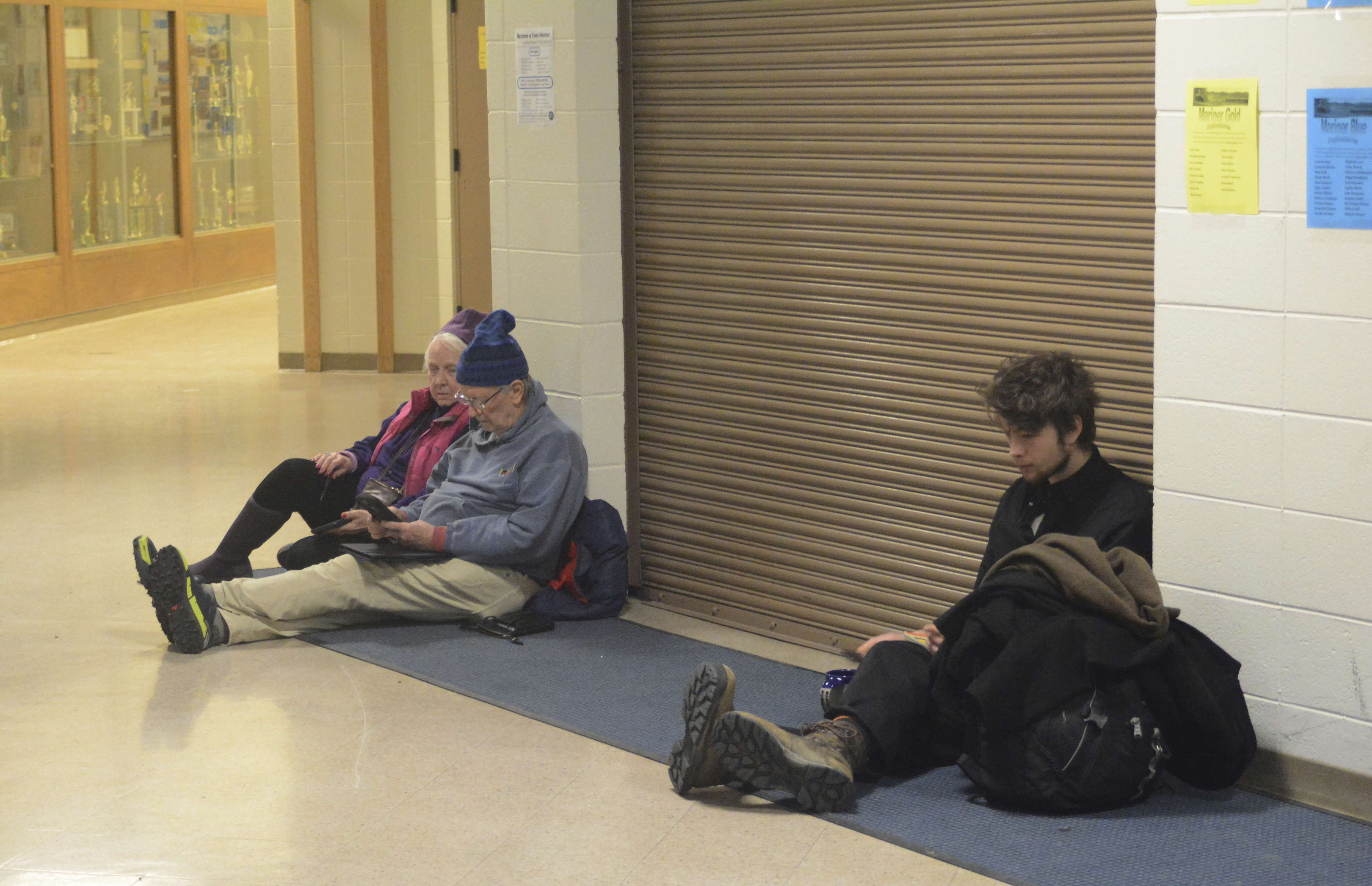 People wait for the all-clear at Homer High School during a tsunami alert for Homer, Alaska