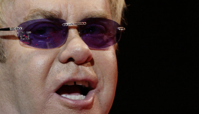 Elton John performing on stage during his 'Red Piano' tour at the O2 Arena in London (PA)