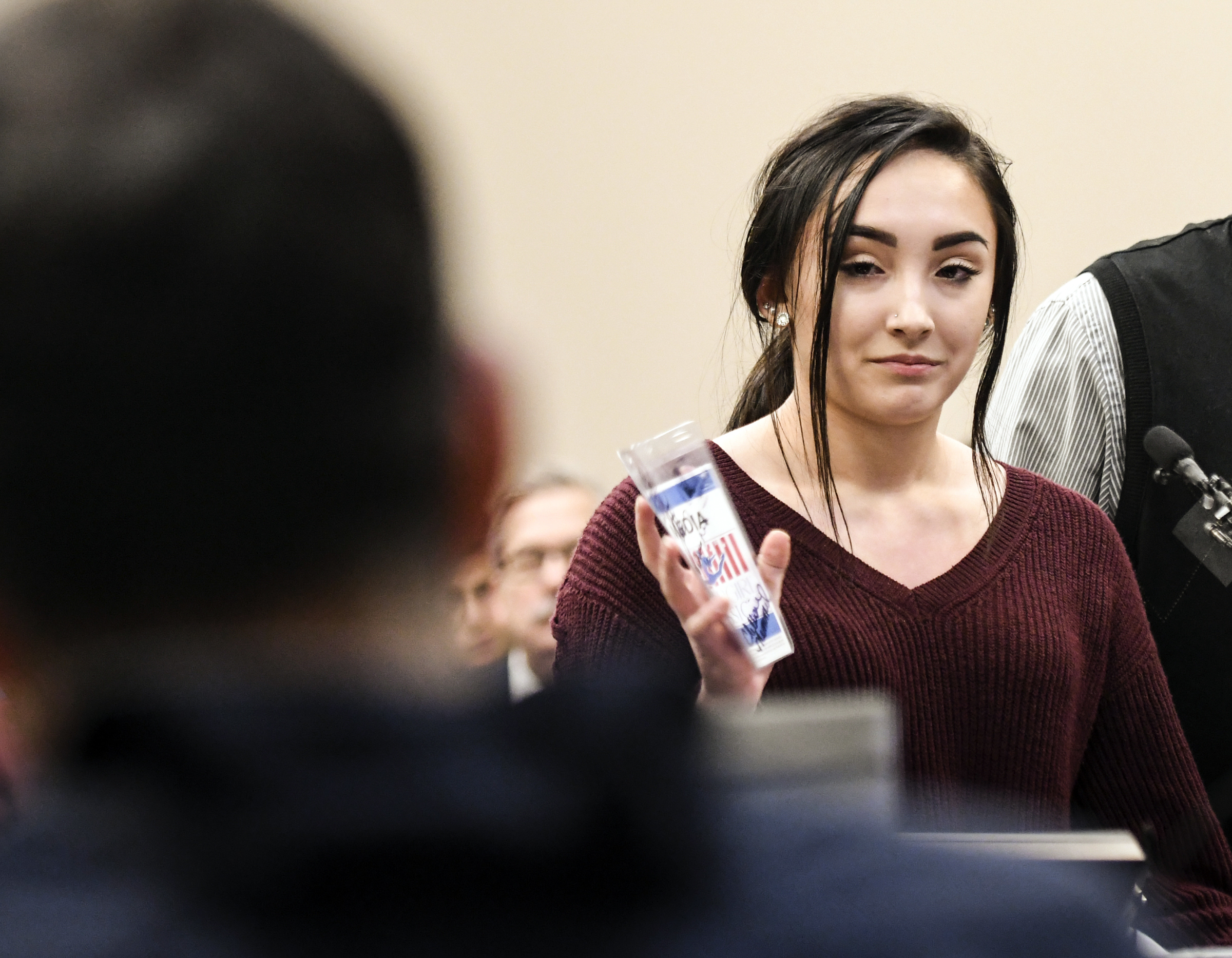 Arianna Guerrero showed a credential Larry Nassar gifted her (Matthew Dae Smith/Lansing State Journal via AP)