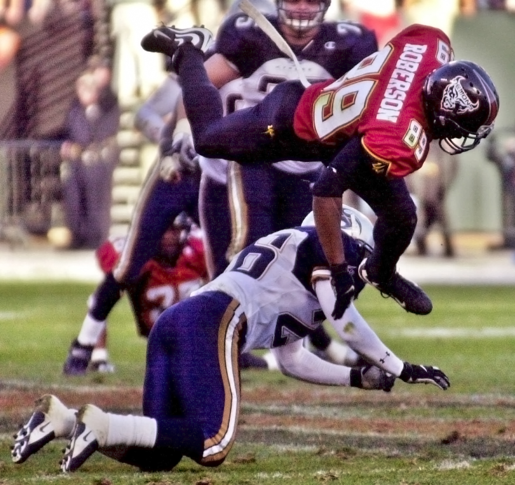 Two American football players during an XFL game