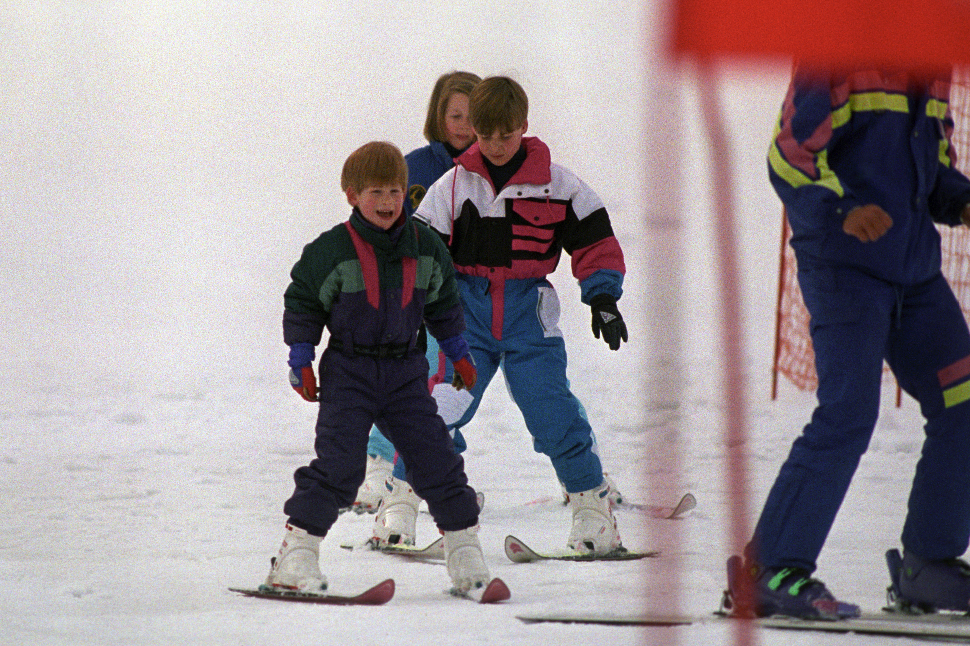 Prince Harry (left) leads his brother Prince William, and cousin Laura Fellowes, down the nursery slopes at Lech, Austria (Martin Keene/PA)