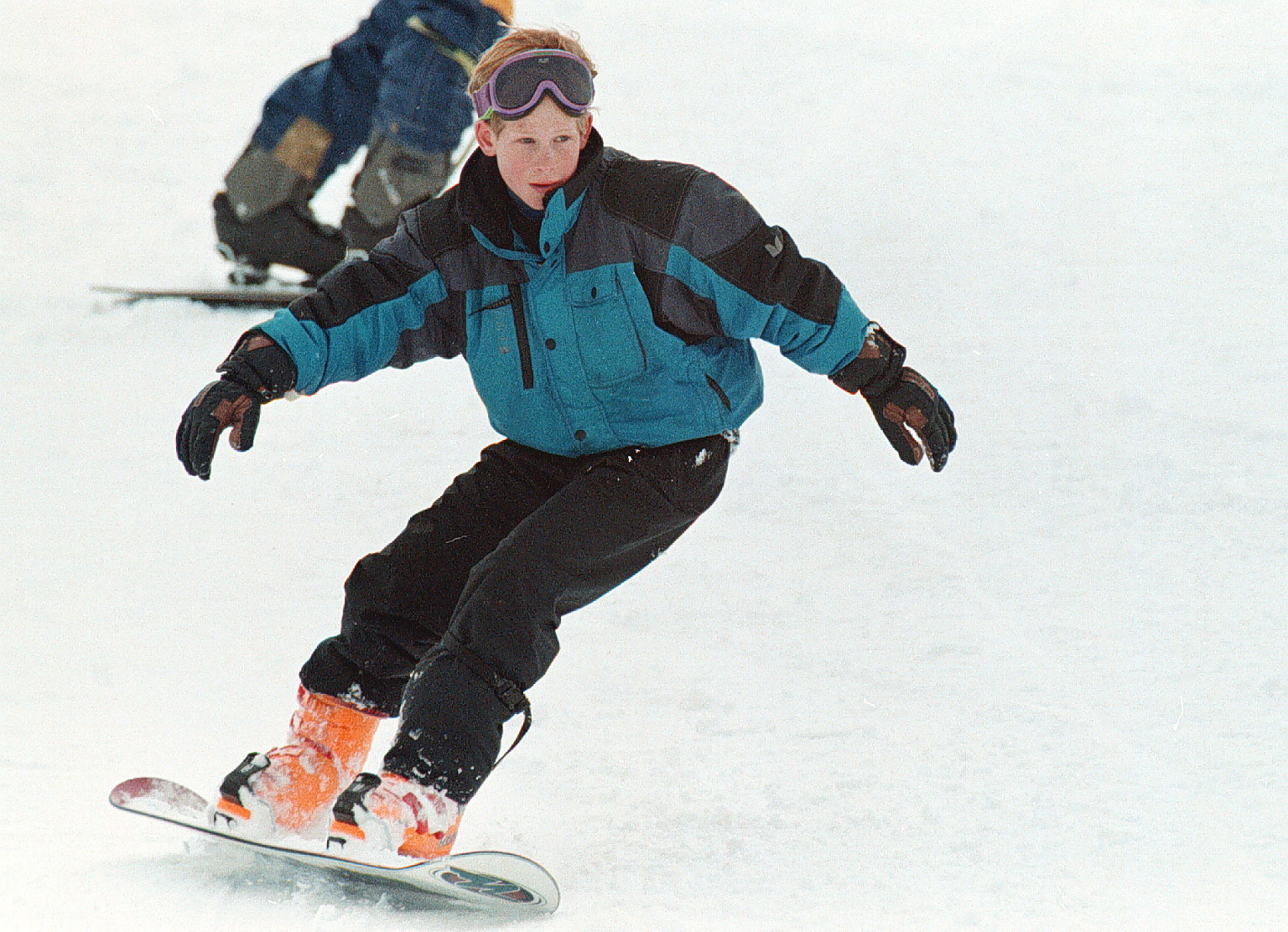 Prince Harry snowboarding in 1996 in Klosters (PA)