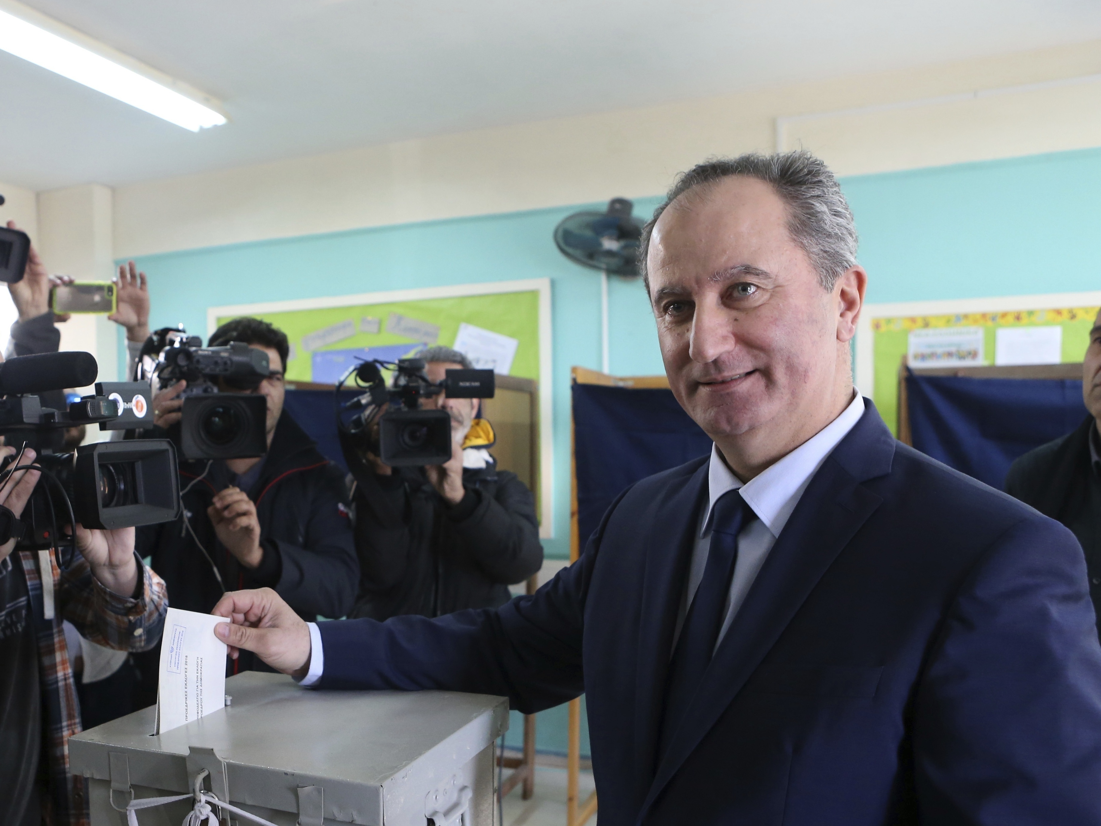 Communist-backed Stavros Malas casts his vote (Petros Karadjias/AP)