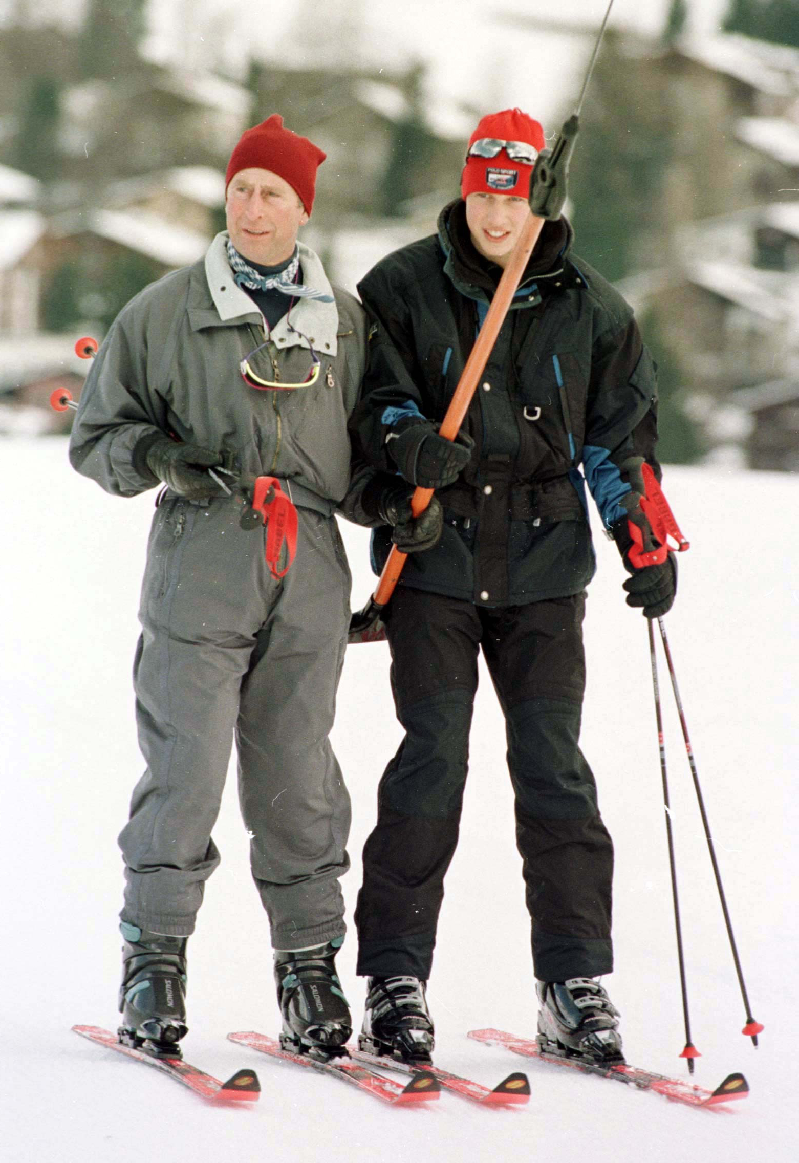 The Prince of Wales (left) and his son Prince William face the media - including the French paparazzi - during their private Alpine holiday in the fashionable Swiss ski resort of Klosters (John Stillwell/PA)