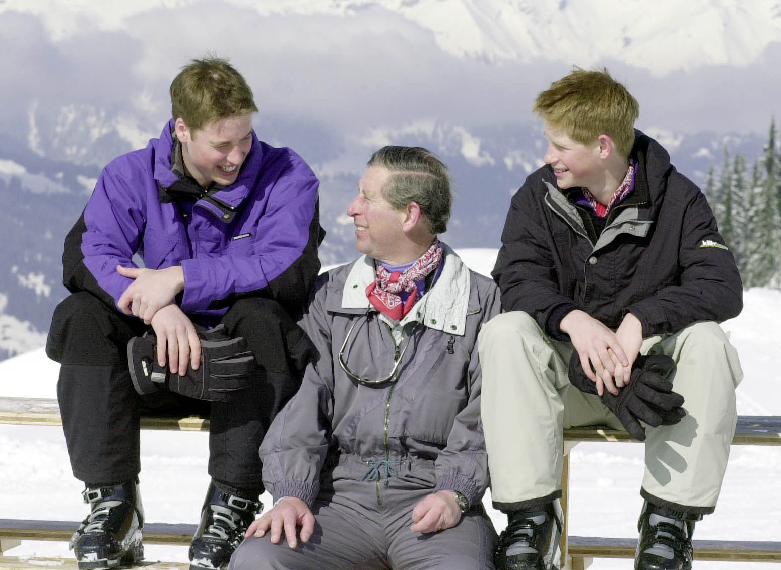 The Prince of Wales and his sons, Prince William (left) and Prince Harry, pose for photographers on the Madrisa ski slopes above Klosters. They are on the third day of their traditional skiing holiday in Swiss resort (John Stillwell/PA